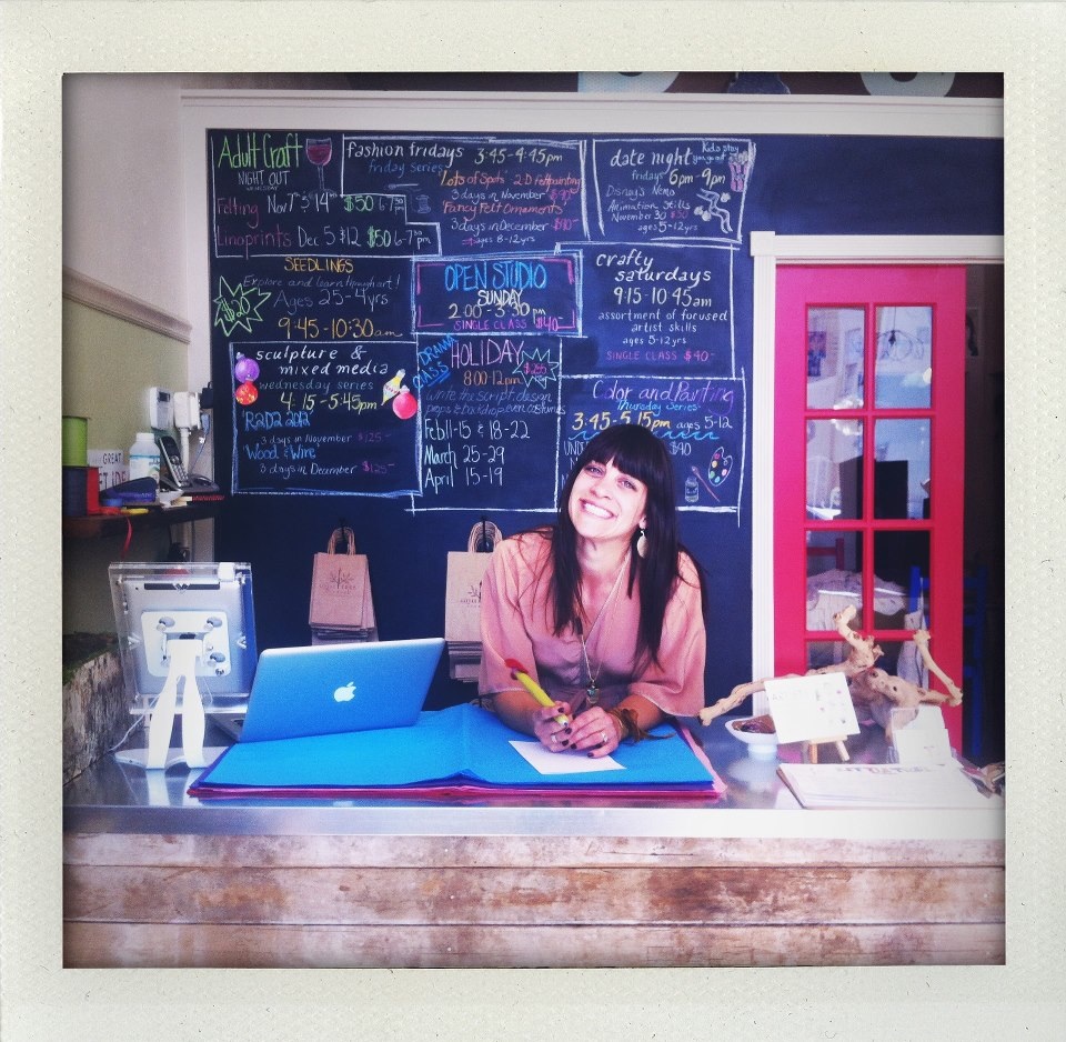 Owner Nichole Farnum behind the counter at Little Tree Studio and Store
