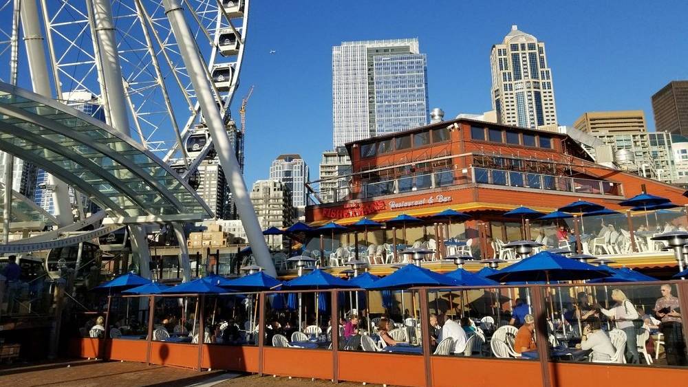 a sunny day with outside seating at Seattle waterfront restaurants fishermans landing