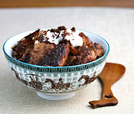 A delicious Nutella Bread Pudding made from a Crock Pot sits in a festive bowl