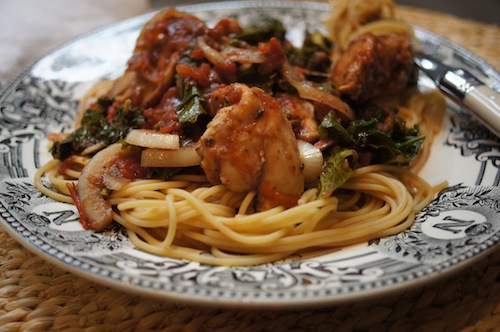 Chicken with Balsamic and Tomatoes is served on a plate with pasta