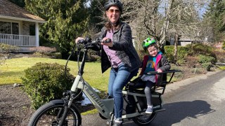 A mom and daughter on a sunny day riding the Aventon Abound ebike for families
