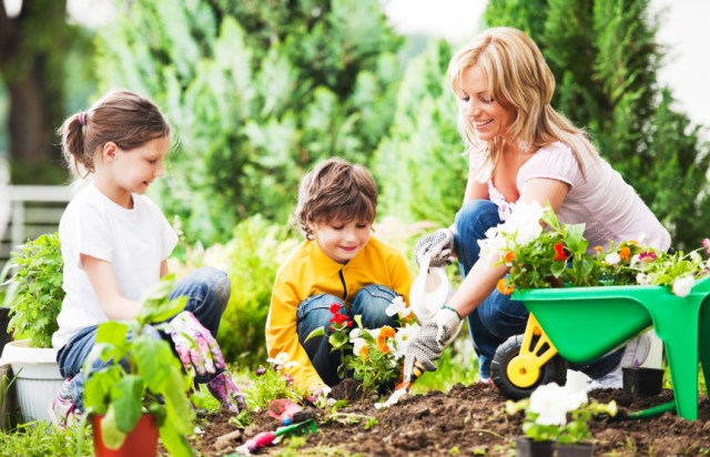 A mother and kids garden as an outdoor family activity