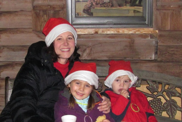Santa hats and hot cocoa mom and kids