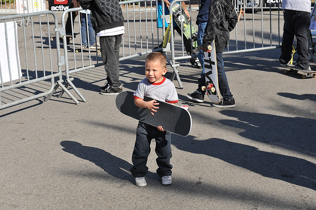 Kid Holding Skateboard