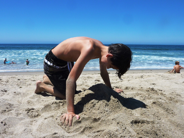 sandcastle-boy-beach