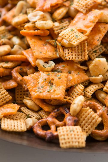 A close of of pretzels and other ingredients in a Ranch Chex mix that was made from a slow cooker recipe