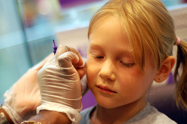 Little Girl Getting Ears Pierced