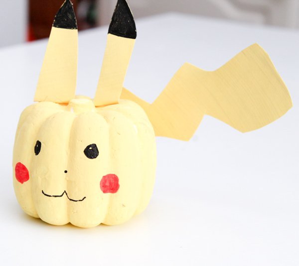 A pumpkin is decorated to look like Pikachu
