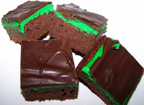 Four dark brown and bright green peppermint brownies