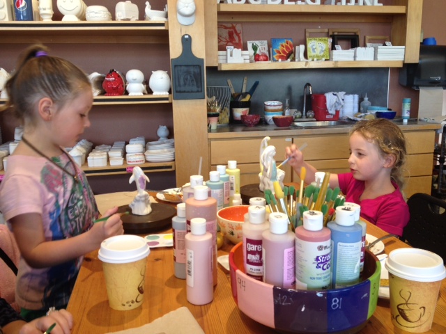 Girls painting pottery in Gig Harbor