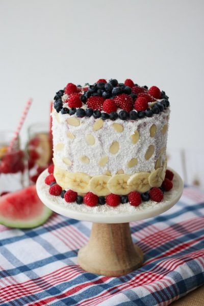 A vegan red white and blue cake made out of watermelon