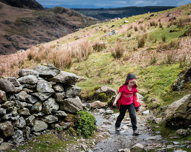 kid in nature, stream, rocks