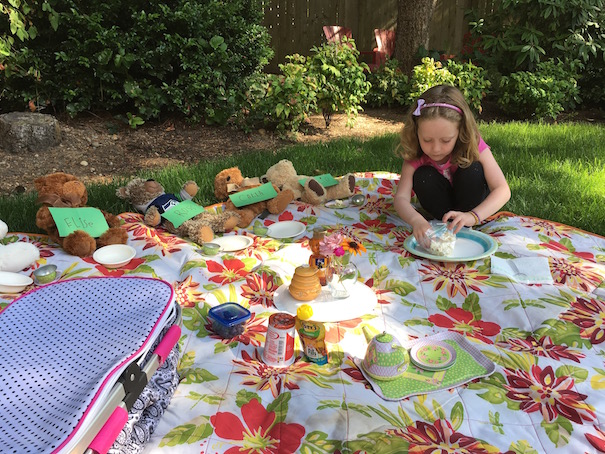 feeding teddies on picnic