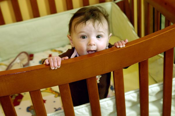 baby-standing-in-crib
