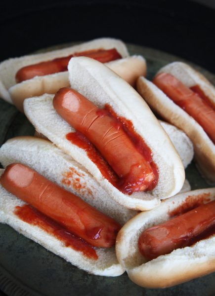 Hot dogs are made to look like severed fingers in a bun for a Halloween themed dinner
