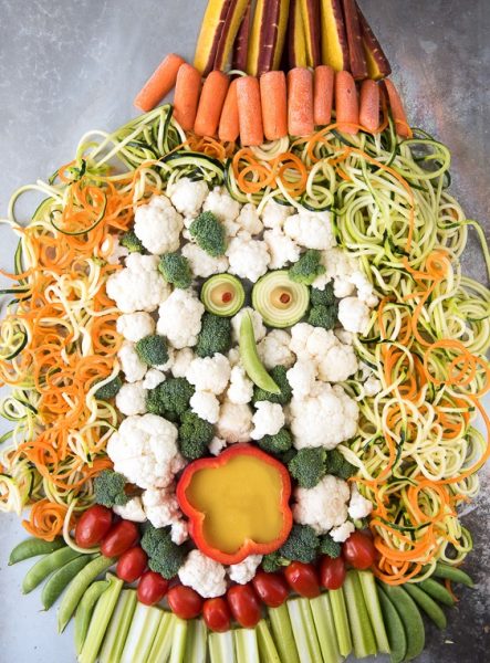 Vegetables arranged to look like a screaming witch as part of a Halloween themed dinner