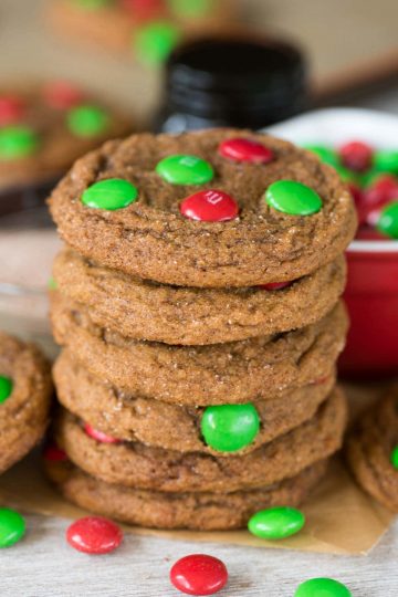A stack of molasses cookies topped with M&Ms