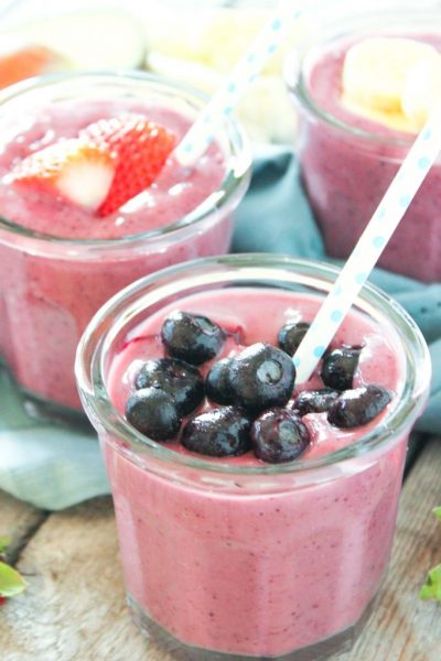Two pink smoothies are topped with fruit and have hidden cauliflower buried away in this recipe for picky eaters