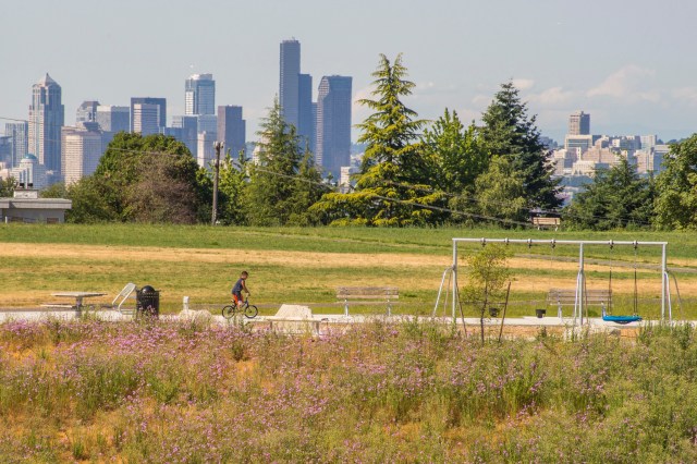 kids are riding bikes after enjoying this picnic spot in Seattle