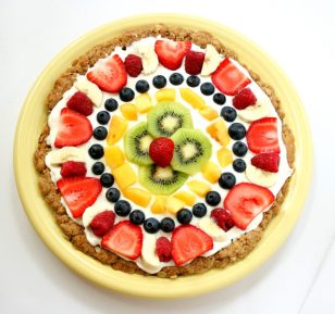 a picture of a fruit pizza, which is a healthy birthday cake alternative