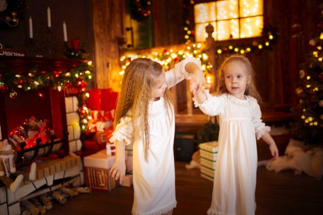 sisters dancing in christmas living room