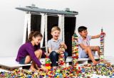 three children playing with legos at best childrens museum