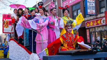 Lunar New Year parade with traditional Chinese outfits in Chicago's Chinatown neighborhood