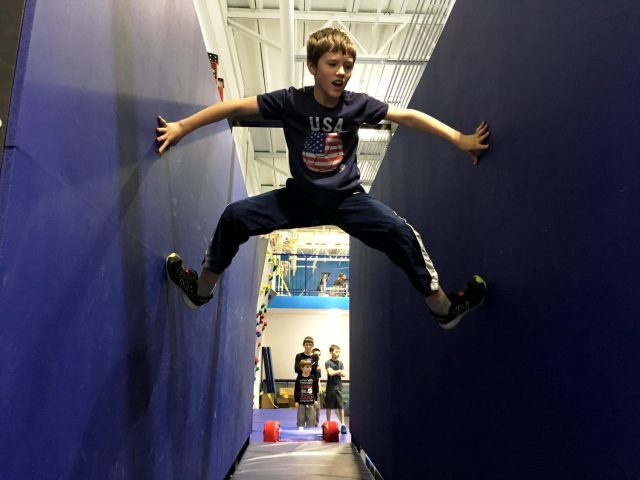 boy climbing wall at windy city ninjas things to do with kids in chicago