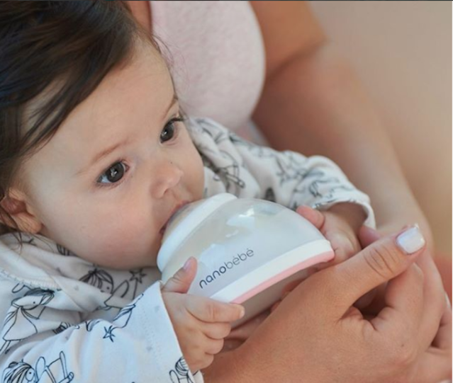nanobebe breastmilk bottle lifestyle closeup usage baby drinking