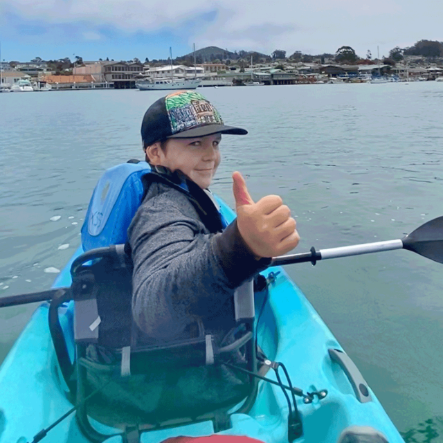 boy kayaking in Morro Bay California