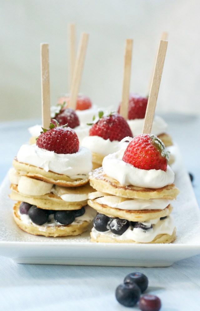 Mini pancakes with whipped cream, strawberries and blueberries for Memorial Day