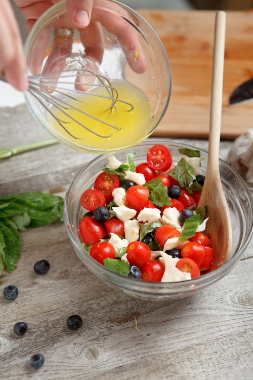 a berry, tomato and cheese salad for Memorial Day