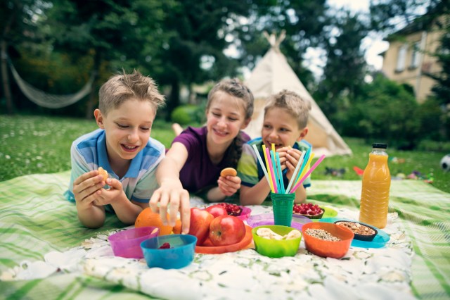 kids enjoying picnic snacks