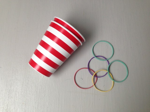 a rocket launcher made from paper cups and rubber bands as a fourth of July craft
