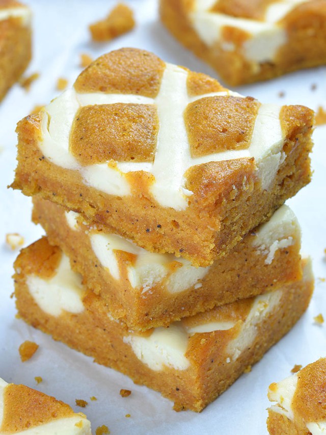 A stack of pumpkin bars made with cream cheese