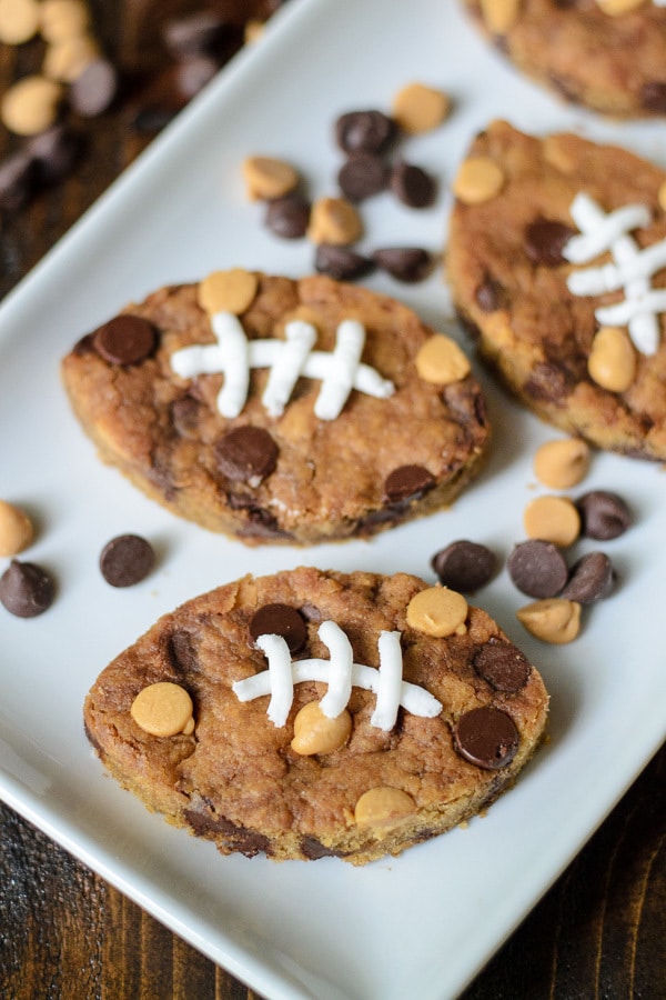 A tray of freshly-made Football Chocolate Chip Peanut Butter Blondies is ready for Thanksgiving dinner as a dessert that isn't pie
