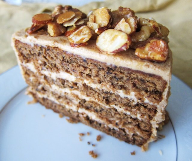 A piece of maple nut cake sits on a plate as a vegan, gluten-free treat for your guests with food restrictions