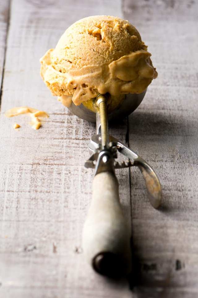 A scoop of homemade ice cream made with five different spices and pumpkin puree.