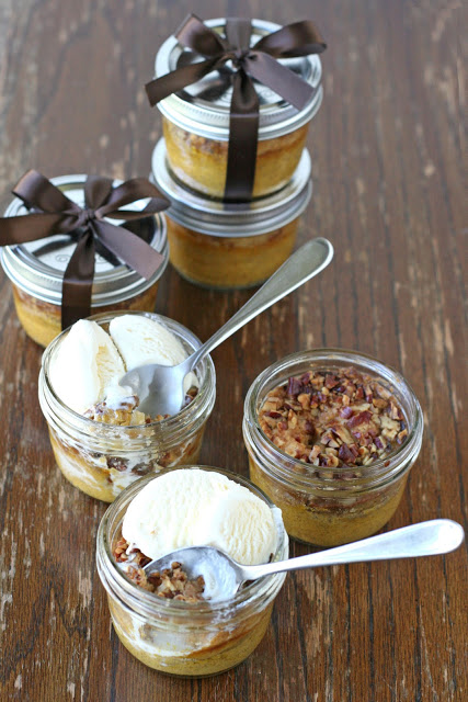 Jars of pumpkin and pecan desserts are topped with ice cream and ready to serve instead of a traditional pie at Thanksgiving dinner