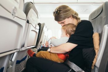 A mom using airplane hacks while traveling with a toddler