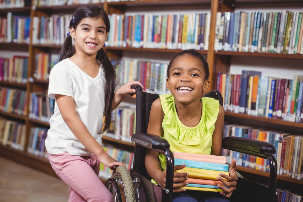 https://tinybeans.com/wp-content/uploads/2019/04/girls-diverse-reading-library-kid-in-wheelchair-istock-e1632262390875.jpg