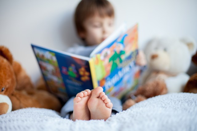 boy reading in bed