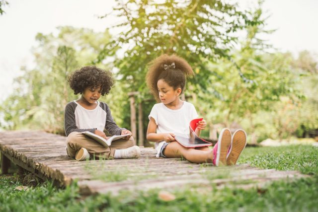 kids reading outside