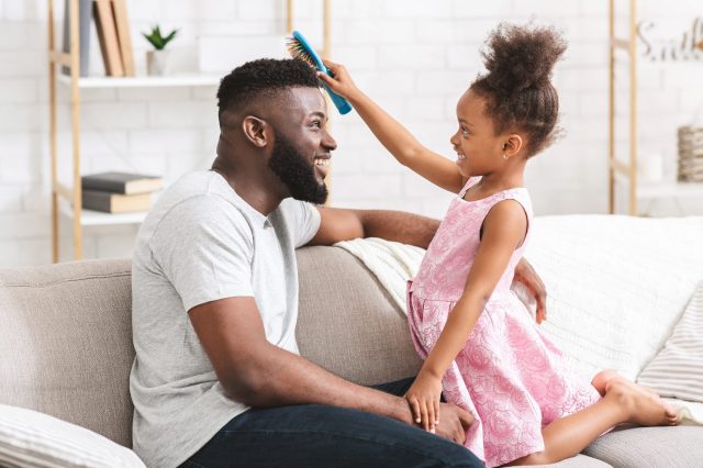daughter combing dads hair as an Indoor Activity for kids