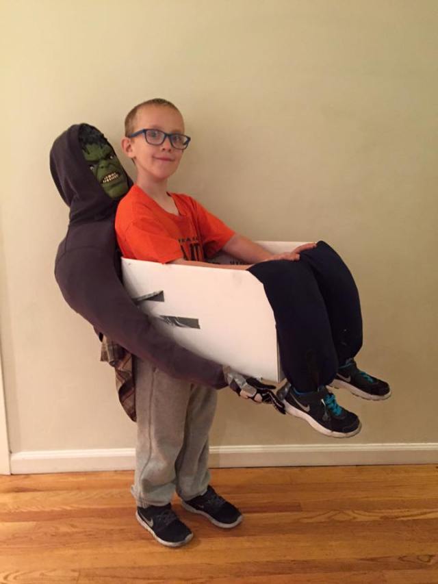 A boy uses an Amazon box to create a Halloween costume