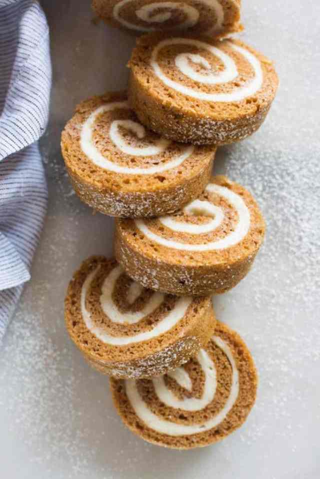 Five slices of a classic pumpkin roll to serve after Thanksgiving dinner instead of pie