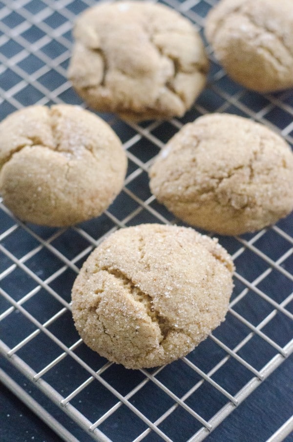 Five eggnog snickerdoodle Christmas cookies sit on a cooling rack