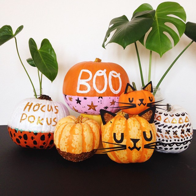 Five glittery pumpkins are decorated without carving