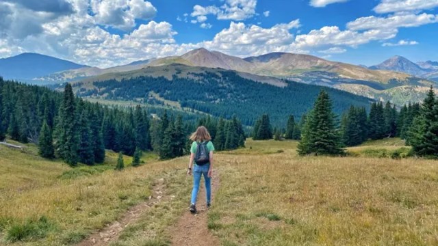 a girl hiking in nature for a story on family new year's resolutions