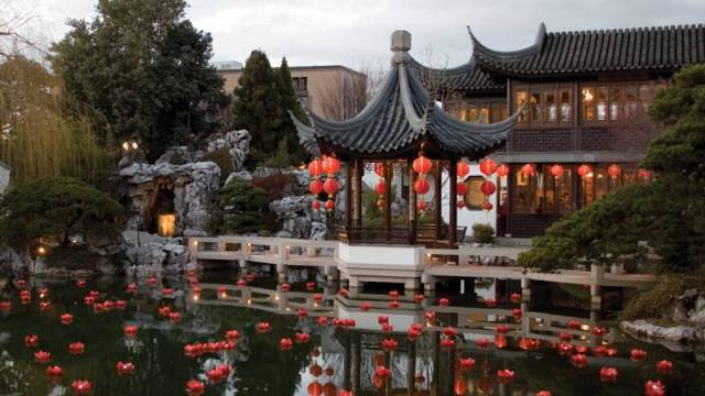 red lanterns float on the water at Lan Su Chinese Garden in Portland